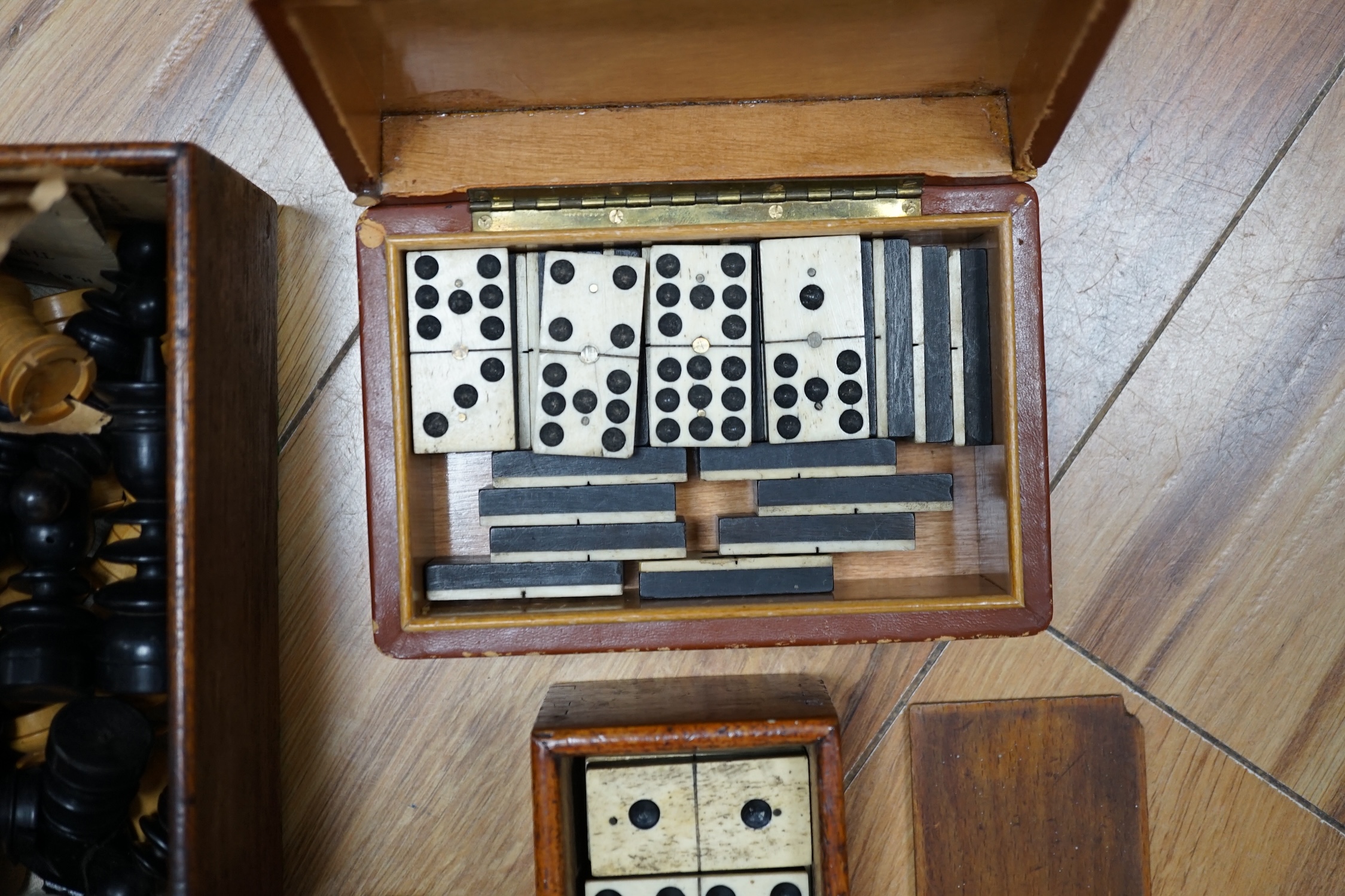 Three sets of dominoes and two chess sets, one Staunton pattern